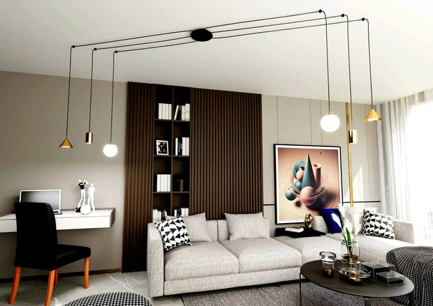 Plafond med gyllene upphängningar och svarta kablar - PlafondLjus